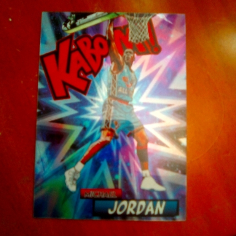 Micheal jordan a kaboom refractor holo card   this cards rate untouched ever